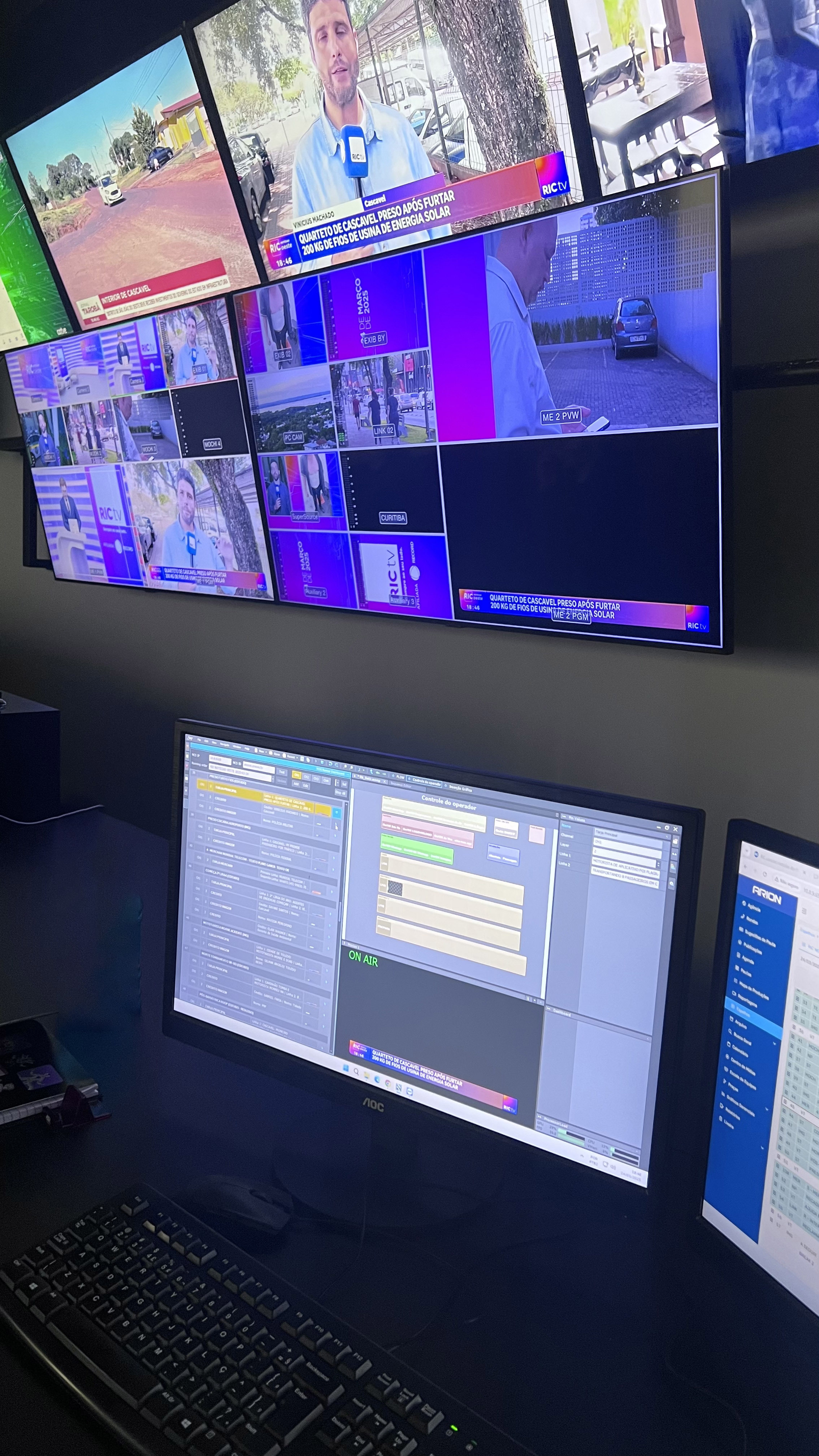 Broadcast control room running Aximmetry, with a multi-camera switcher wall and program monitors